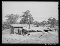 Back of dugout of Jack Whinery. To the front can be added above-ground rooms. Pie Town, New Mexico by Russell Lee