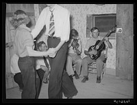 Musicians at the square dance. Pie Town, New Mexico by Russell Lee
