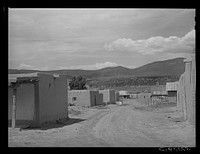 Main street, Chamisal, New Mexico by Russell Lee