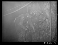 [Untitled photo, possibly related to: Gold miner operating pneumatic drill at Mogollon, New Mexico] by Russell Lee