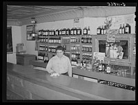 Barkeeper. Penasco, New Mexico by Russell Lee