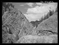 [Untitled photo, possibly related to: The Million Dollar Highway between Silverton and Ouray is cut through massive rock formations. Ouray County, Colorado] by Russell Lee