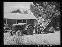 Tractor and corn machinery bought by Cornish corn machinerycooperative. Preston, Idaho. This is a FSA (Farm Security Administration) cooperative by Russell Lee