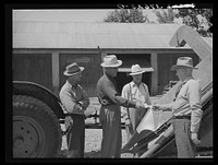 [Untitled photo, possibly related to: Chairman of Cornish machinery cooperative handing over check to dealer in payment of ensilage harvester. Preston, Idaho] by Russell Lee