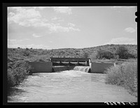 One of main irrigation canals. Bernadillo County, New Mexico by Russell Lee