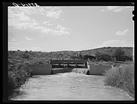 One of the main irrigation canals. Bernalillo, New Mexico by Russell Lee