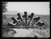 FSA (Farm Security Administration) cooperative waterwheel near little field. Mohave County, Arizona by Russell Lee