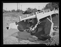 Detail of bridge washed out by recent flood of Sacramento River in Tehama County, California by Russell Lee