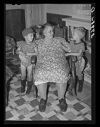 Wife of Jo Webster with their two sons in their farm home in El Camino district. Tehama County, California by Russell Lee