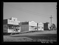 Some of the business enterprises at Central Valley, California. This section of the town has lost business because the main highway was rerouted and left it stranded. Central Valley is one of the boom towns near Shasta Dam by Russell Lee