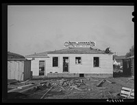 Roofing a house under construction at Pacific Beach, California, which is about six miles from San Diego by Russell Lee