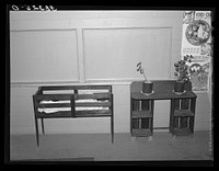 Furniture made of vegetable crates and scrap lumber. Community building of the Yuba City FSA (Farm Security Administration) farm workers' camp. Yuba City, California by Russell Lee