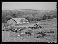 [Untitled photo, possibly related to: Barn and farm equipment of fruit farmer. Placer County, California. Notice the spraying carts] by Russell Lee
