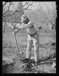 Farmer from Oklahoma who has bought land in Placer County through Federal Land Bank. He is cleaning out an irrigation ditch. California by Russell Lee