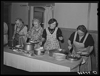 Dishing up dinner for the members of the Loomis Fruit Association cooperative who are holding their fortieth annual meeting. Loomis, California.  Placer County by Russell Lee