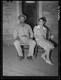 Oklahoma farmer and his wife who have moved to California. First they picked cotton as migrant workers, then rented a farm and have now bought the thirty-eight  acre farm through the Federal Land Bank. Placer County, California by Russell Lee