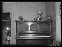 Piano in home of fruit farmer. Placer County, California by Russell Lee