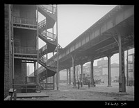 [Untitled photo, possibly related to: Children playing under the elevated on the southside of Chicago, Illinois] by Russell Lee