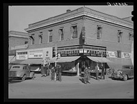 [Untitled photo, possibly related to: Chain stores on main street of La Junta, Colorado] by Russell Lee