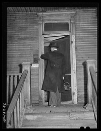 Doctor entering home of relief family. Chicago, Illinois by Russell Lee