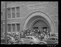 Crowd coming out of Pilgrim Baptist Church. Southside of Chicago, Illinois by Russell Lee