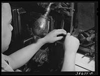 [Untitled photo, possibly related to: Linotype operator. Chicago, Illinois] by Russell Lee