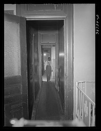 Hall leading to apartment of  railroad worker. Chicago, Illinois by Russell Lee