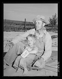 Mr. Schroeder and his son. He is a FSA (Farm Security Administration) rehabilitation borrower. Dead Ox Flat, Malheur County, Oregon by Russell Lee