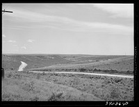 Road leading up to bench land. Vale-Owyhee irrigation project, Malheur County, Oregon. While the higher bench land is not so fertile as that in the lower valleys, it is oftimes desirable to farm the bench land because drainage of irrigation waters does not constitute a great problem by Russell Lee