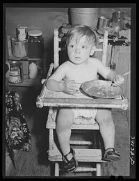 Child. FSA (Farm Security Administration) migratory labor camp mobile unit. Wilder, Idaho by Russell Lee