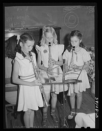 Schoolgirls give a musical number at the 4-H Club Spring fair. Adrian, Oregon by Russell Lee
