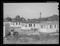 [Untitled photo, possibly related to: Streetcars which have been converted into dwellings. These rent for twenty-five dollars per month. They are equipped with electricity, running water and bathrooms. San Diego, California] by Russell Lee
