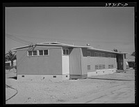 Building which houses the sanitary facilities at FSA (Farm Security Administration) camp for defense workers. San Diego, California by Russell Lee
