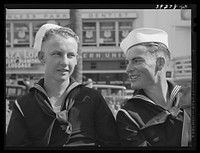 Sailors talking in square in midtown. This square is a general gathering place. San Diego, California by Russell Lee