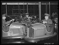 Marines riding the electric automobile at Mission Beach amusement center. San Diego, California by Russell Lee