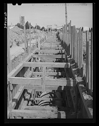 [Untitled photo, possibly related to: Construction work of the sewage disposal plant and sewer lines leading to it. About ten miles of sewer pipe are being laid on this project. San Diego, California] by Russell Lee
