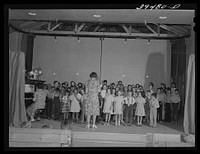 Schoolchildren in program at end of school term. FSA (Farm Security Administration) labor camp. Caldwell, Idaho by Russell Lee
