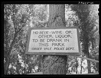 Sign in Riverside Park at Vale, Oregon. The picnic on the Fourth of July was in this park. Most of the farmers in this predominately agricultural area are from the Dust Bowl states and the church has strong influence by Russell Lee