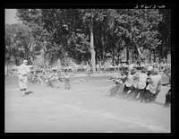 Kids tug of war at the Fourth of July celebration at Vale, Oregon by Russell Lee