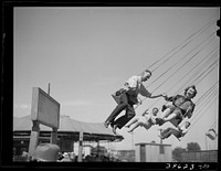 Ride at the carnival which was part of the Fourth of July by Russell Lee