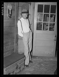 Farmer watching game in poolroom at Stem, Granville County, North Carolina. Sourced from the Library of Congress.