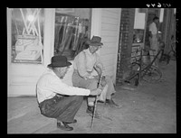 Men discussing the election on steps of general store in Stem, Granville County, North Carolina. Sourced from the Library of Congress.