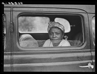 Migratory agricultural worker with seven others in the car on their way to Cranberry, New Jersey, for the potato season. Sourced from the Library of Congress.