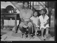 Three of the thirteen children of William Sanders,  farmer who has only recently begun receiving FSA (Farm Security Administration) aid. Saint Inigoes, Maryland. Sourced from the Library of Congress.