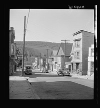[Untitled photo, possibly related to: Street in the important anthracite town of Coaldale, Pennsylvania, showing huge coal bank in background]. Sourced from the Library of Congress.