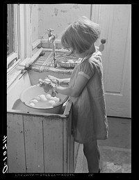 Washing eggs to be sold at Tri-County Farmers Co-op Market at Du Bois, Pennsylvania on Reitz farm, near Falls Creek, Pennsylvania. Sourced from the Library of Congress.