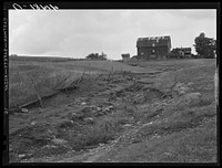[Untitled photo, possibly related to: A dried up creek and old farmhouse near Townsend, New York]. Sourced from the Library of Congress.