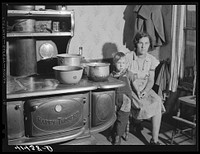 [Untitled photo, possibly related to: Mrs. Garland and her little boy. Family lives in the submarginal farm area of Rumsey Hill, near Erin, New York]. Sourced from the Library of Congress.
