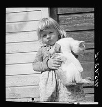 Small daughter of Mr. Uhro Miki, Finnish farmer in the submarginal area of Rumsey Hill, near Erin, New York. Sourced from the Library of Congress.
