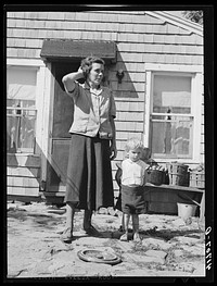 [Untitled photo, possibly related to: Mrs. Thomas Festa and one of her children. FSA (Farm Security Administration) client, Italian, on the back porch of her house two miles out of Newtown, Connecticut]. Sourced from the Library of Congress.